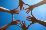 hands together in the sky making a circle